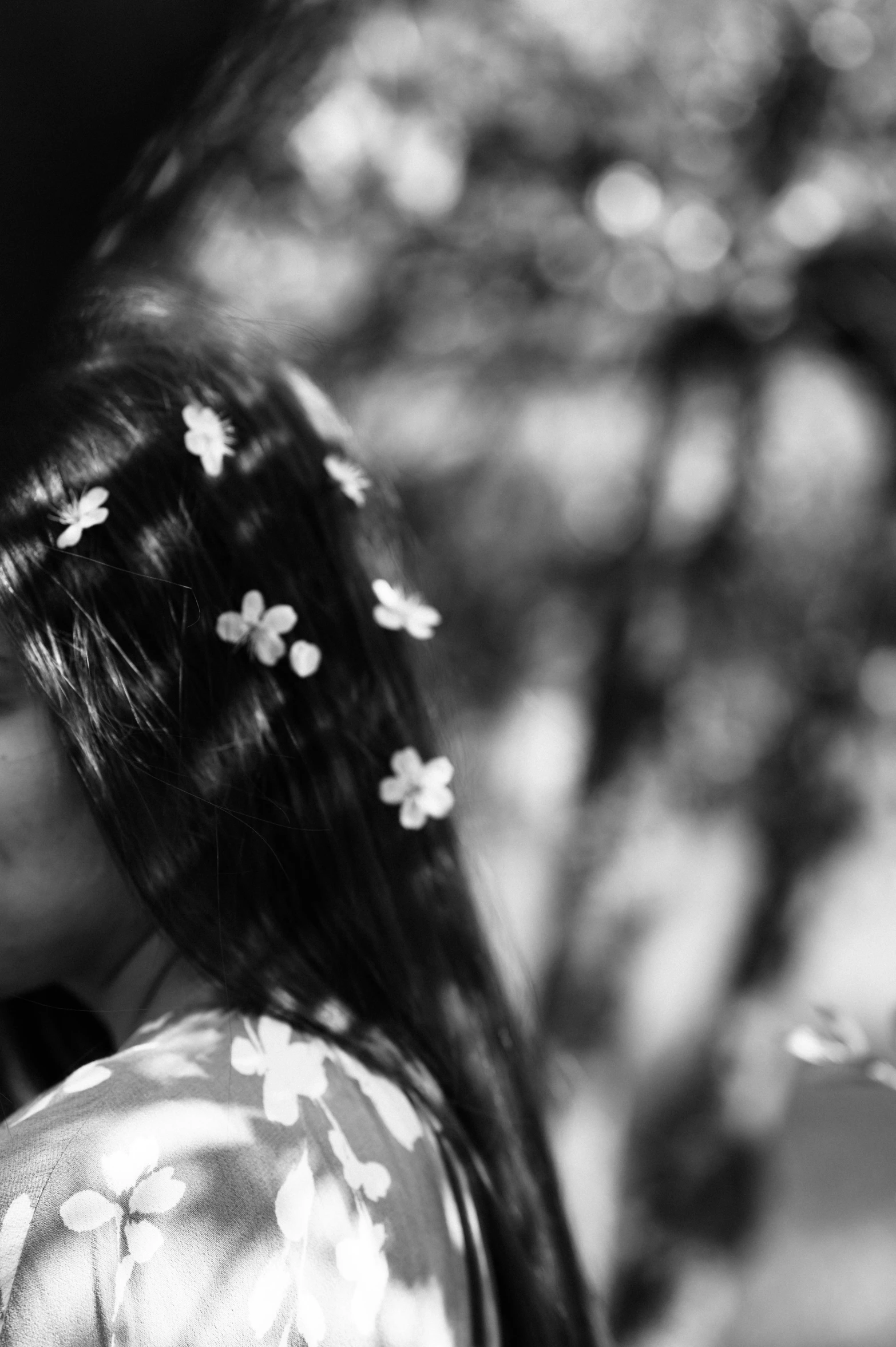 a woman standing in front of some trees