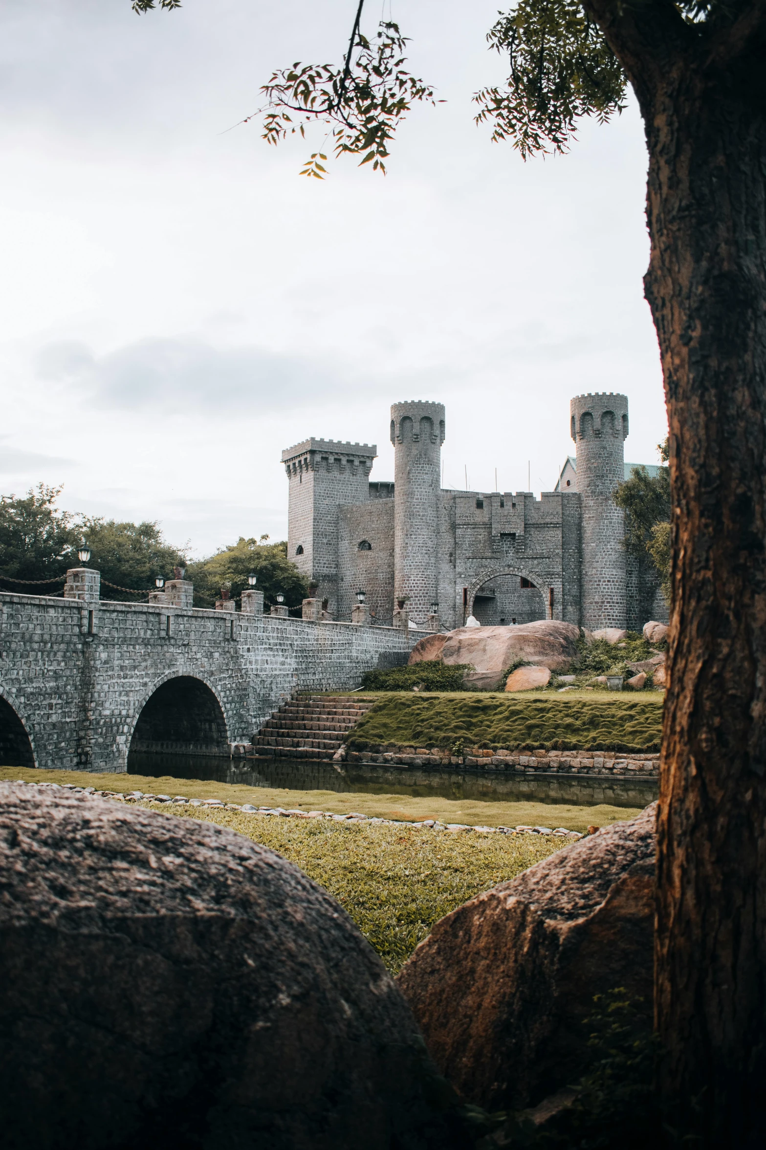 an image of a castle sitting near the water