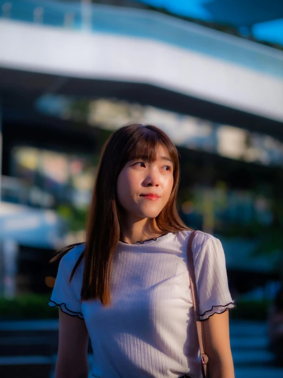 the woman is standing in front of a building