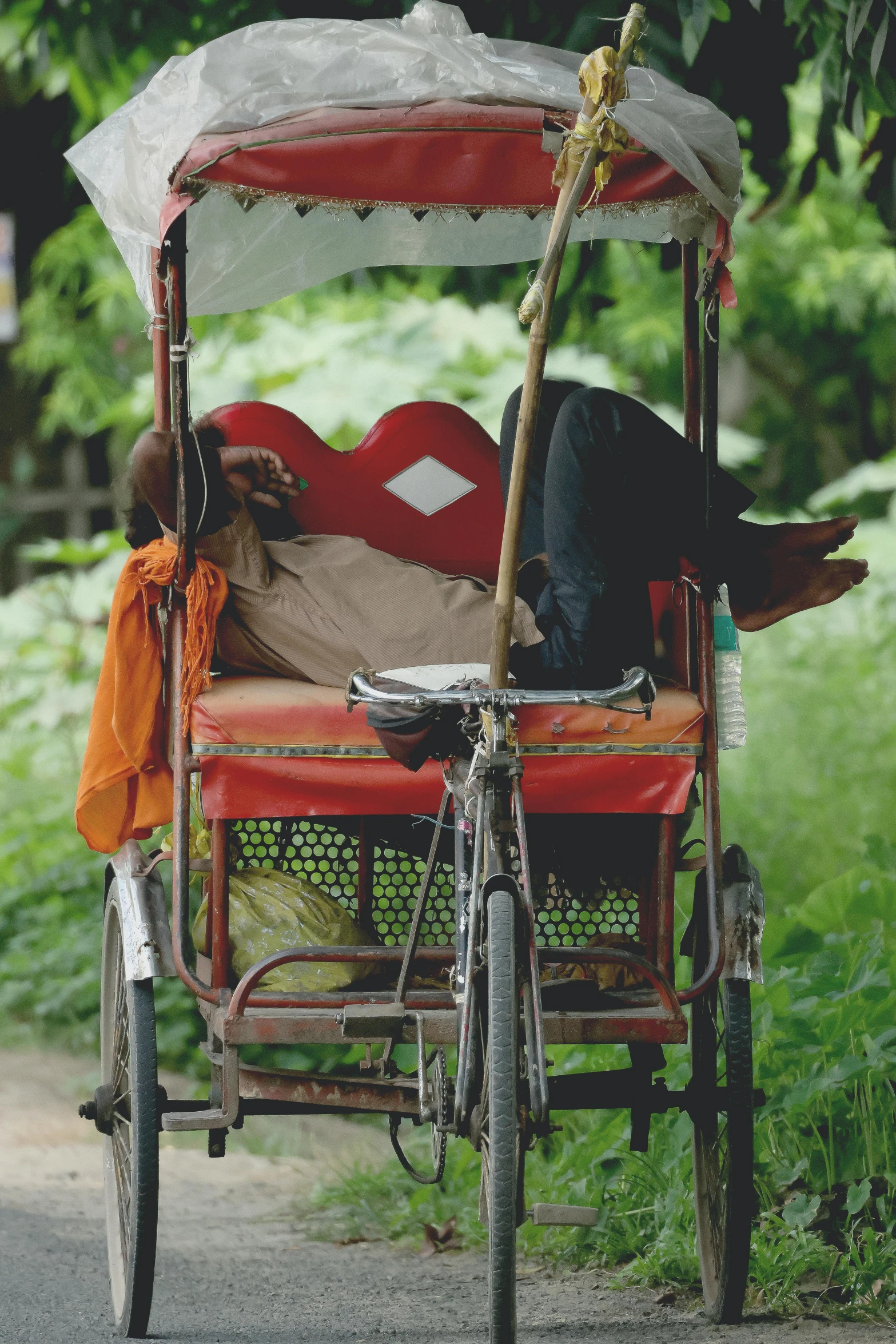 there is a red buggy with a child in it