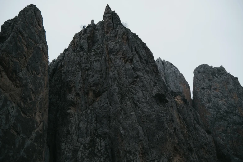 a large group of rocks with mountains in the background