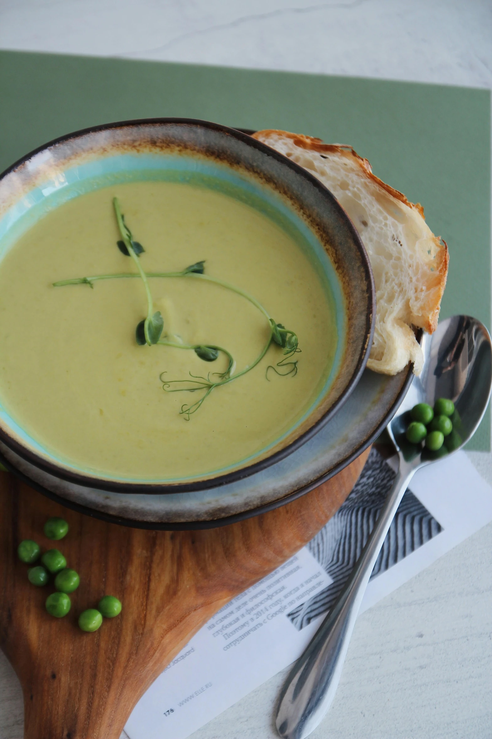 soup with pea seeds and cheese in a blue bowl