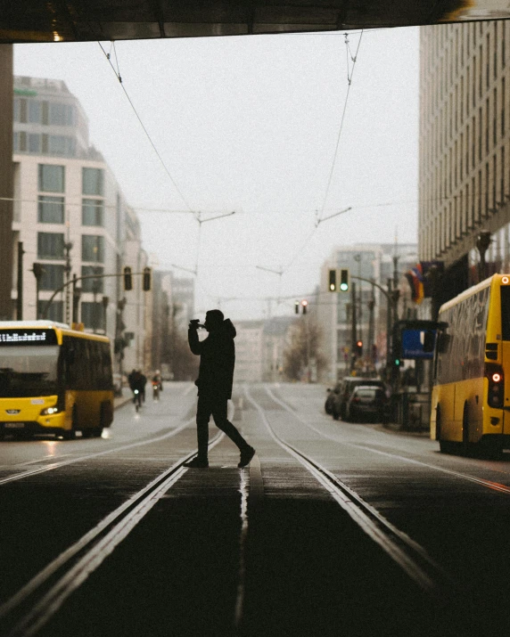 a person is taking pictures on the city street