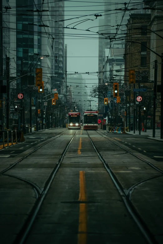 two buses passing each other on a city street