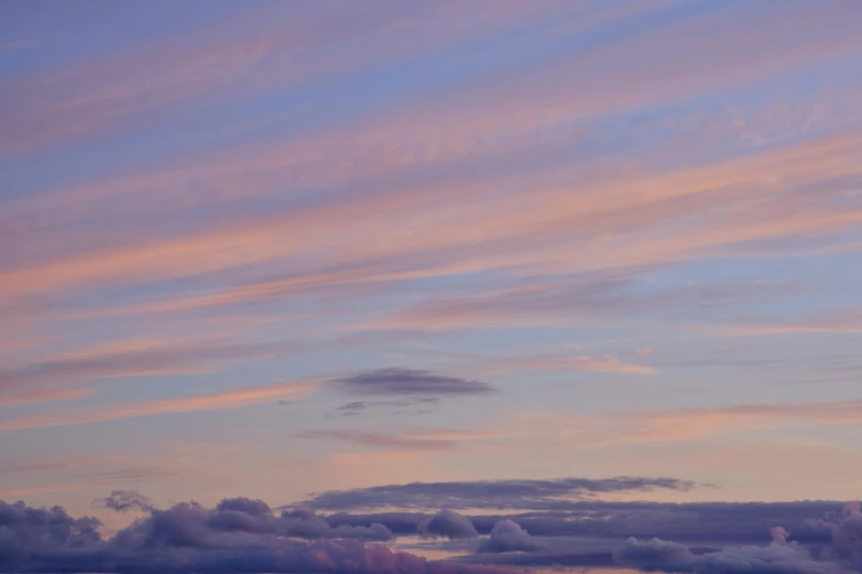 an airplane that is flying high up in the sky