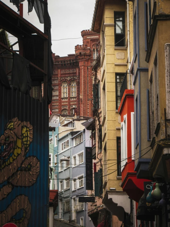 city scene with buildings and one person walking on the sidewalk