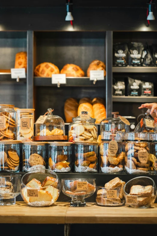 an assortment of food items displayed on wooden counter