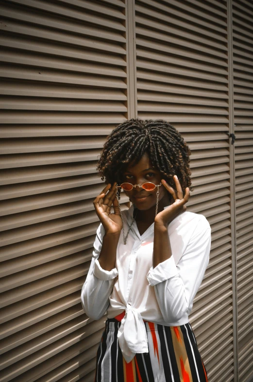 a woman with a pair of red sunglasses on her face