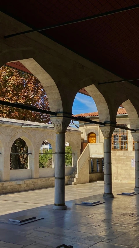 the walkway of an empty courtyard in the town