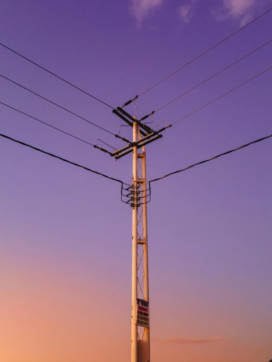 power lines above a city street at twilight