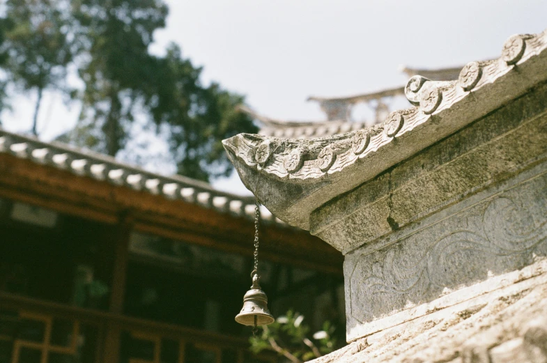 a bell attached to the side of a building