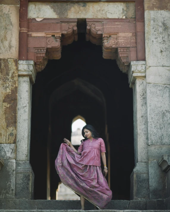 a beautiful young lady standing on a step