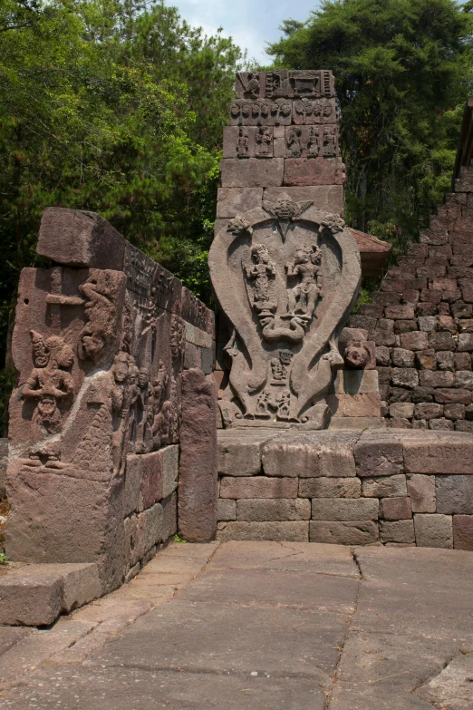 the carvings are on the stone structure, which is made of cement