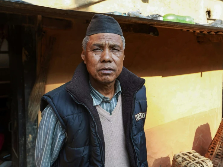 man standing with a hat on his head