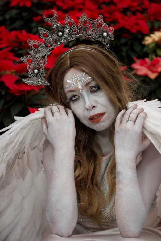 a beautiful young woman in costume dressed as an angel