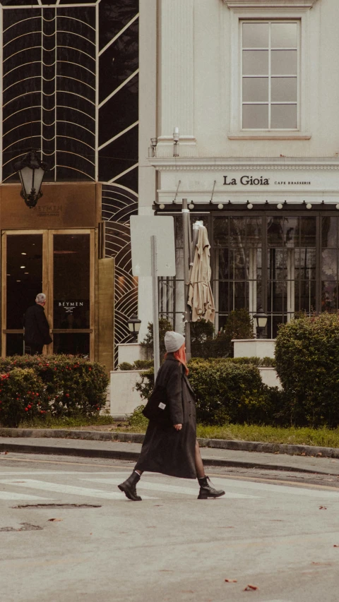 man walking in the middle of street during daytime