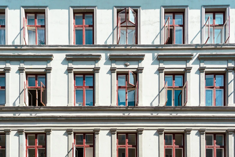 several windows and iron bars on a building