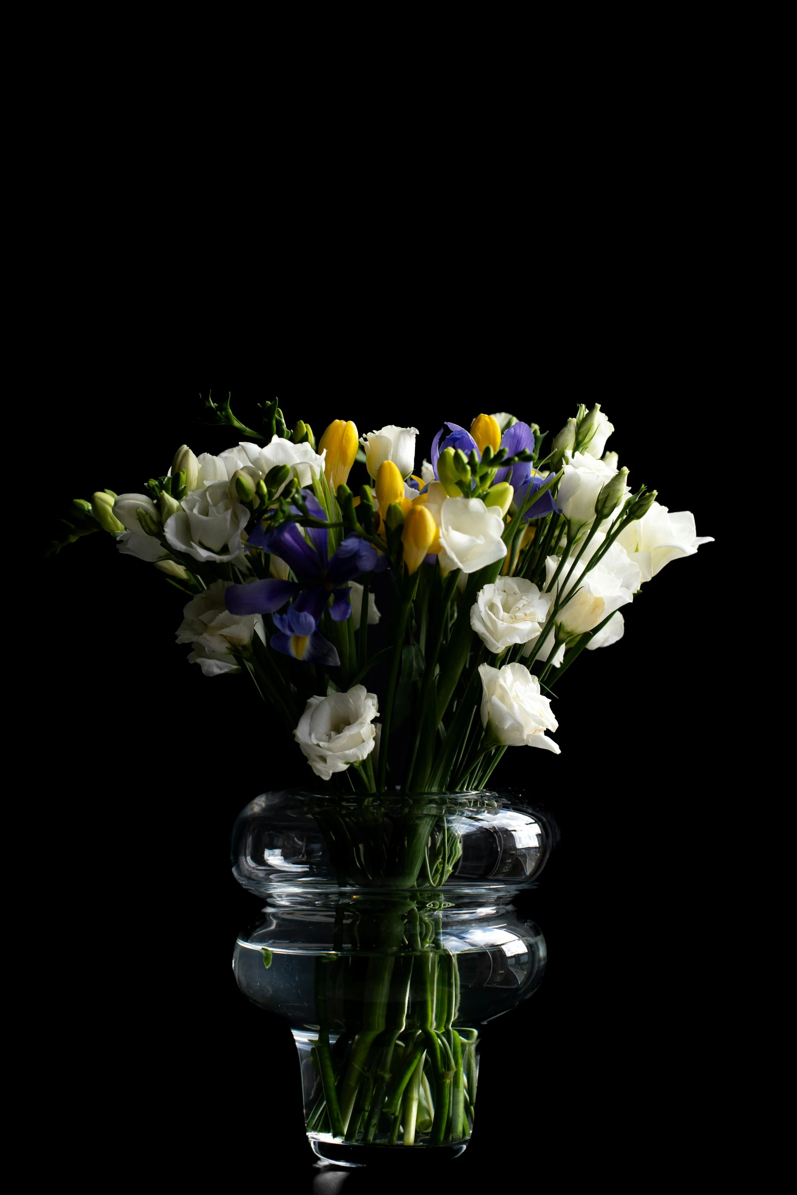 colorful flowers are shown in a clear vase