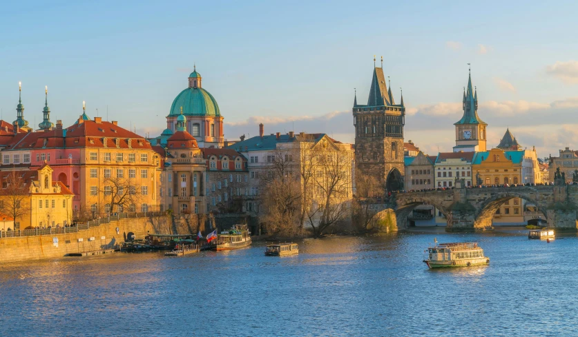 the old city buildings next to the water