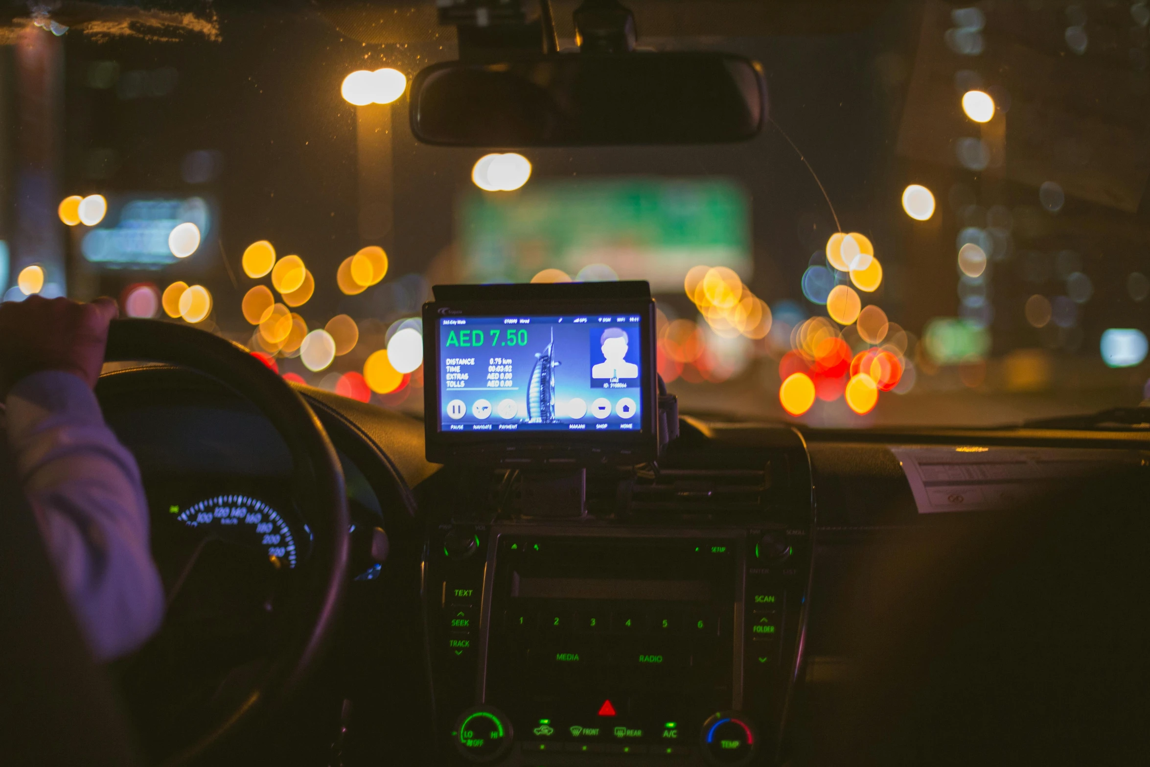 a dashboard with an electronic device that looks like a cell phone