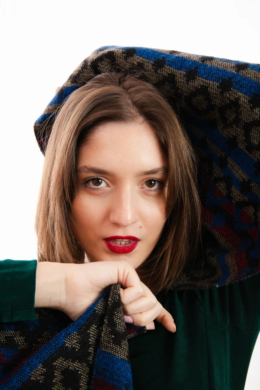 a woman with long hair wearing a colorful scarf