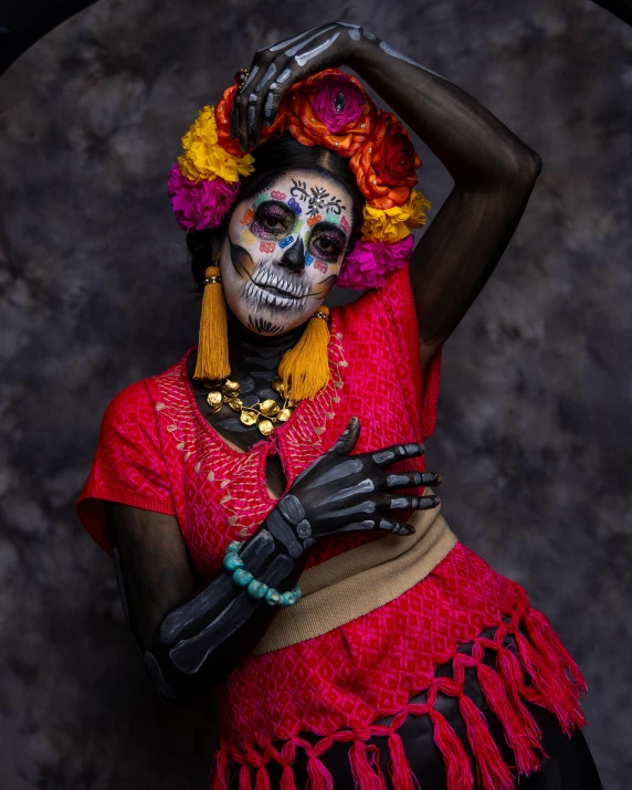 a skeleton woman in bright colors and makeup