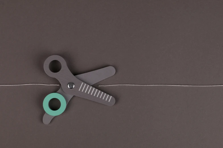 small scissors that are in front of a bag