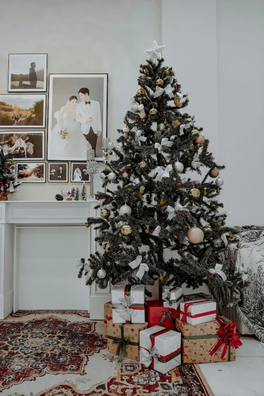 a living room filled with presents under a christmas tree