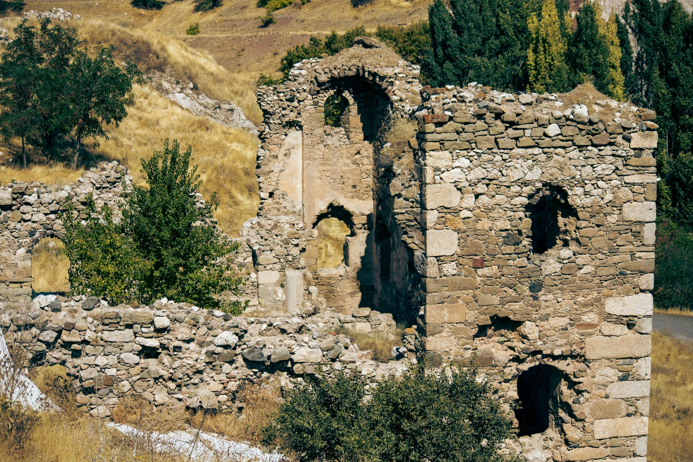 a large old stone building with two windows