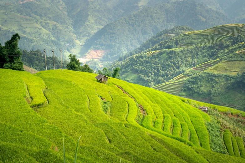 an amazing view of a hill with grass in the foreground