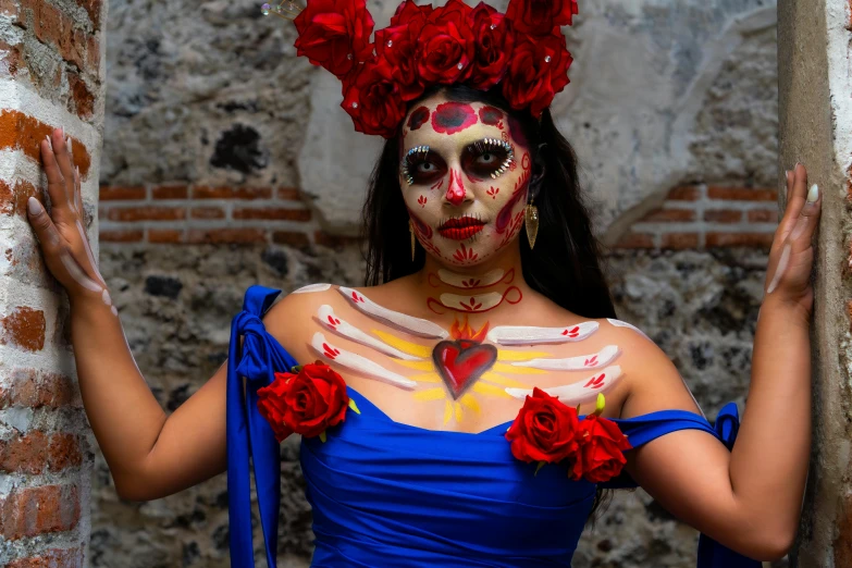 woman with a makeup design in skeleton outfit holding roses