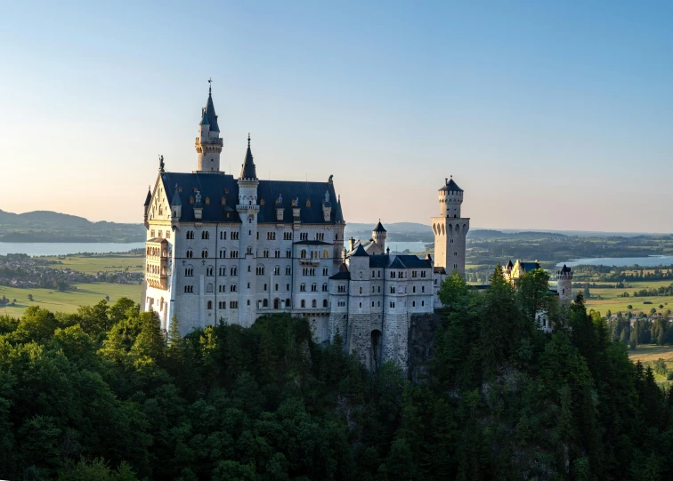 an old castle perched in the middle of the trees