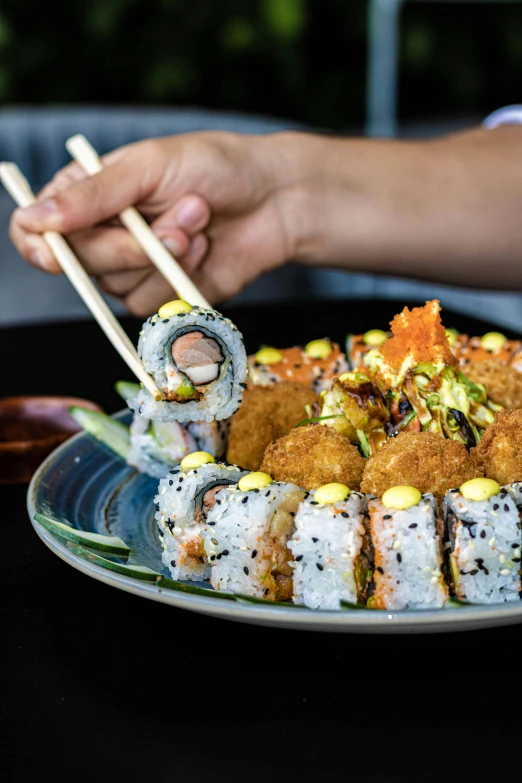 sushi plate topped with several different types of sushi