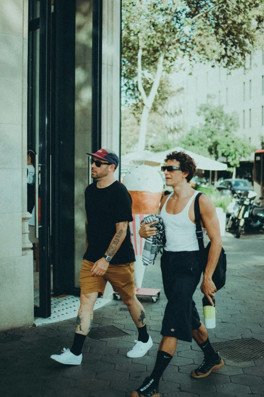 two men are walking in the street together