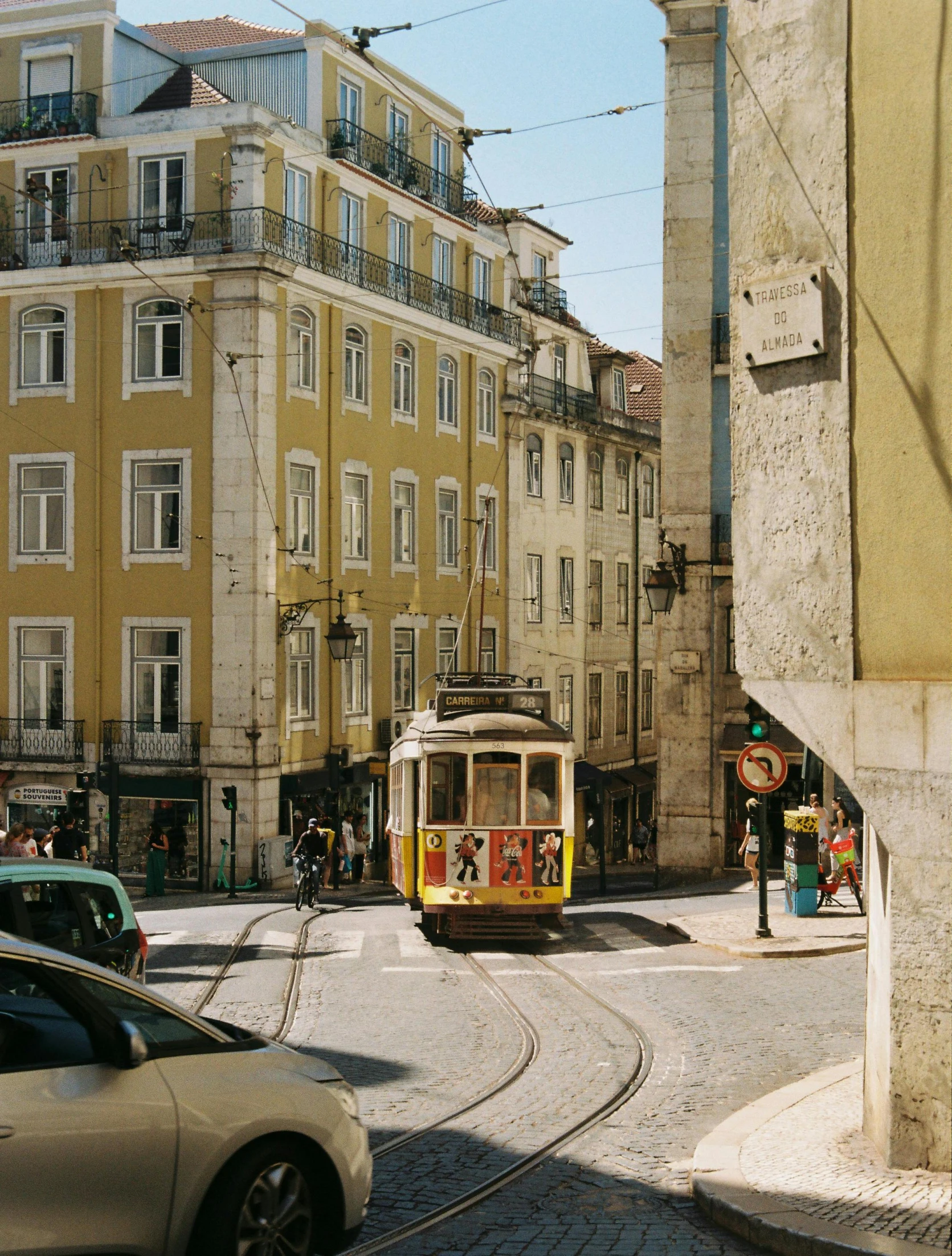 a trolley going down the street on a clear day