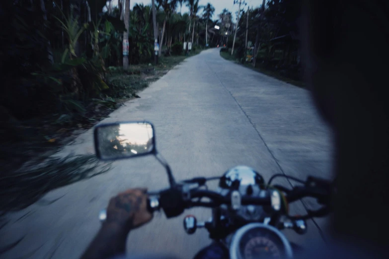 a picture taken from a motor bike in a driveway