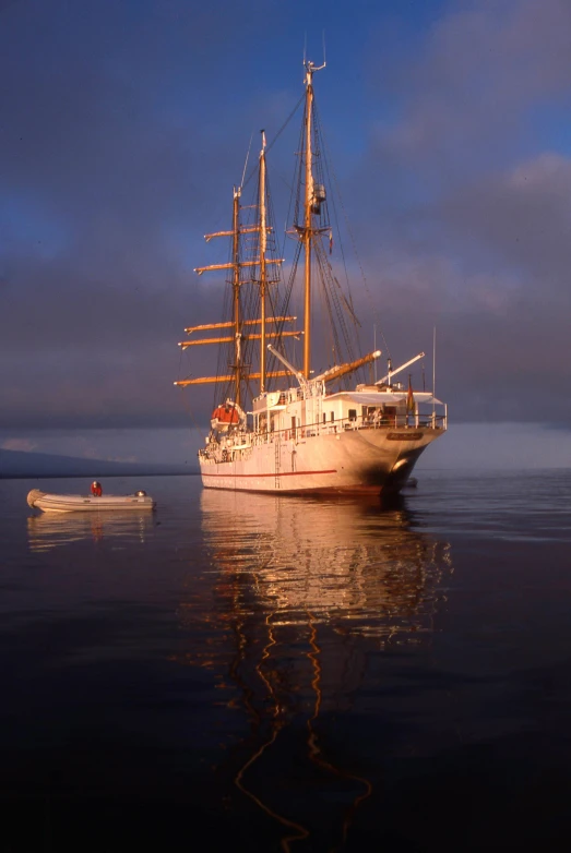 a boat floats on the water in a harbor