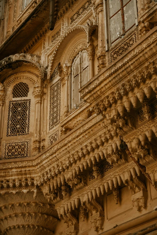 the balcony of an old building with ornate carvings