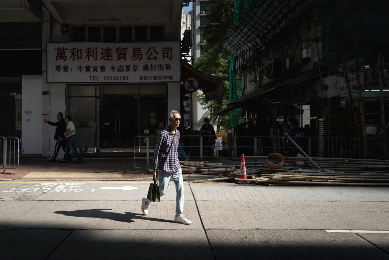 a man on a street with a skateboard on the ground