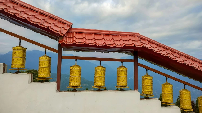 a couple of bells mounted to the side of a building