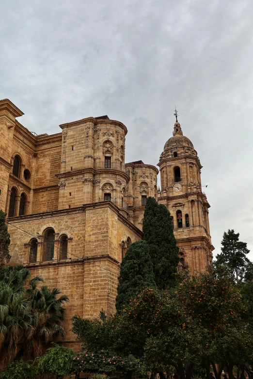 a stone building with trees near by