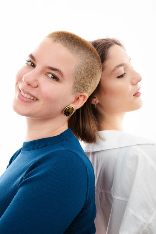 two people that have one woman standing next to one another