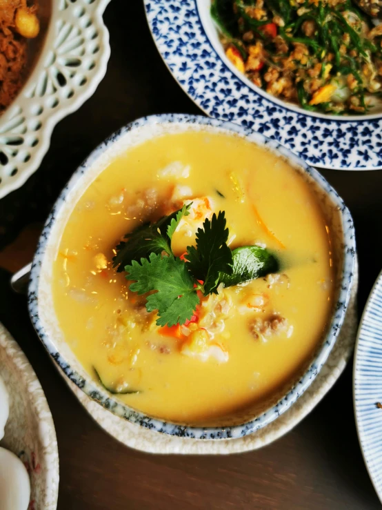 some bowls are topped with soup and vegetable