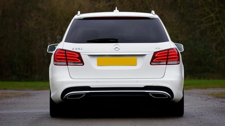 a white mercedes benz e350 is parked in the parking lot