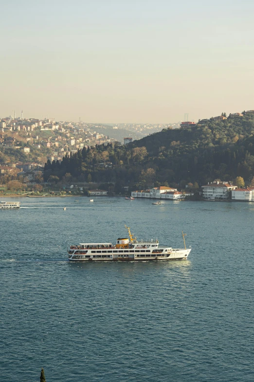 a white boat floating on top of a large body of water