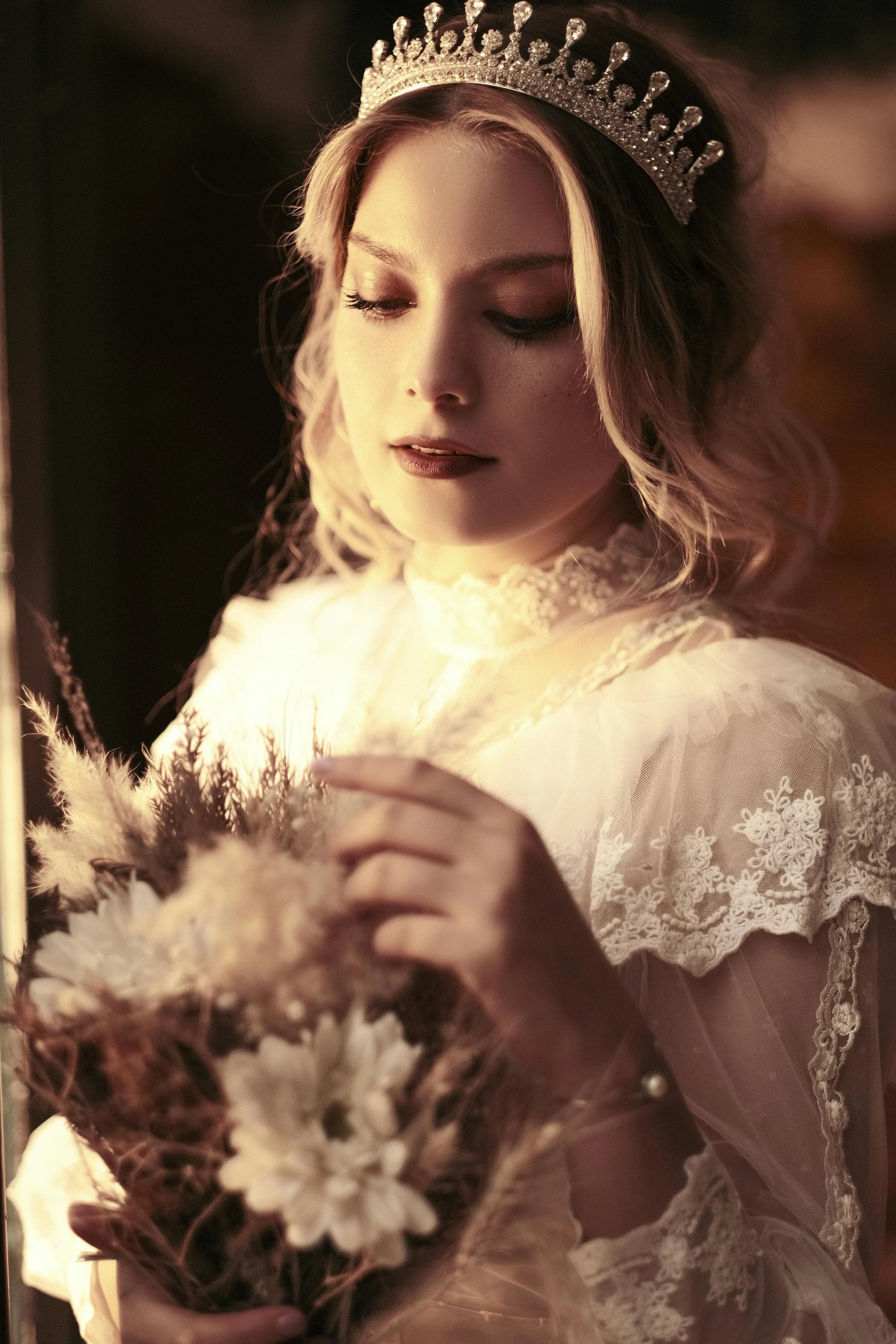 a woman wearing a crown and holding a bouquet