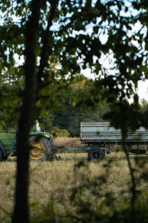 a farm truck and a tractor in a field