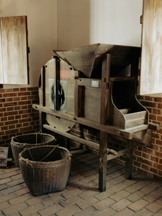 a large wooden oven sitting next to a wall