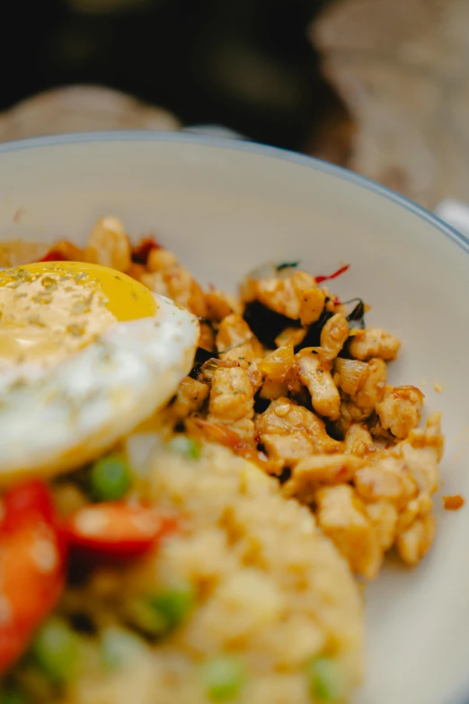 an egg is on top of some vegetables