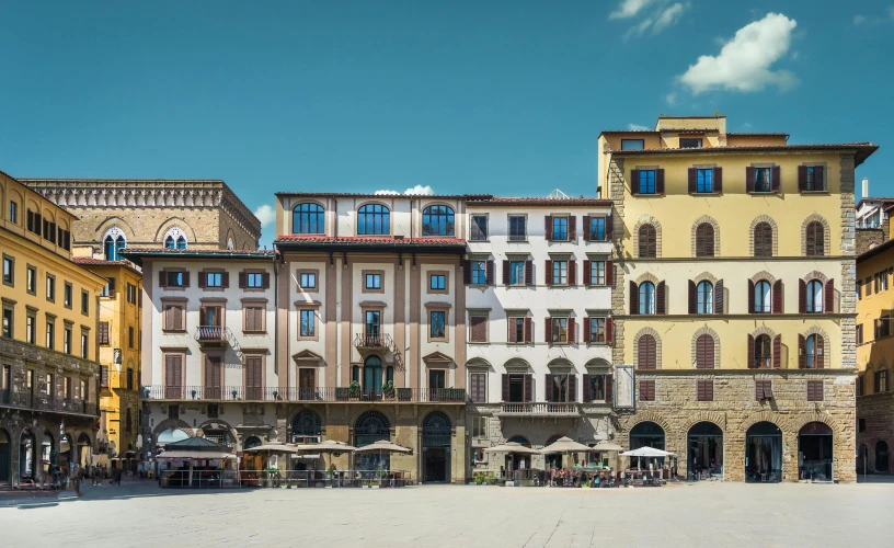 several large buildings in the middle of an intersection